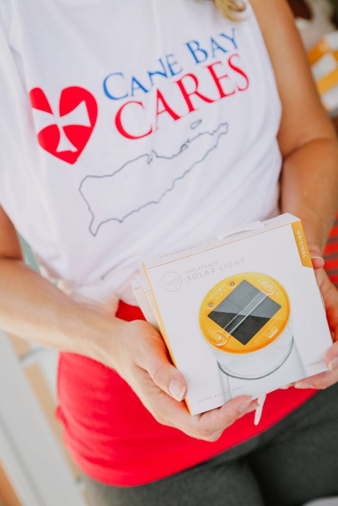 Cane Bay Partners volunteers distribute several thousand pounds of food, hundreds of LUCI solar lights and 6 pallets of water donated by St. Croix Foundation at Zion Christian Academy on Saturday, Nov. 11. Photo credit: Nicole Canegata http://nicolecanegata.com/
