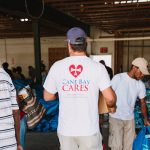 750 individuals and families received overflowing bags of food from Cane Bay Cares ahead of the Thanksgiving holiday Tuesday, Nov. 21 at Foundation Ministries. Photo credit: Nicole Canegata http://nicolecanegata.com/