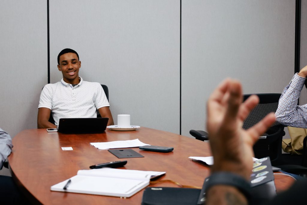 GHCDS Senior Jalen Fleming listens in along with teammates as Boomerang Eats Founders Khalid and Zayd Saleem discuss entrepreneurship with the group.