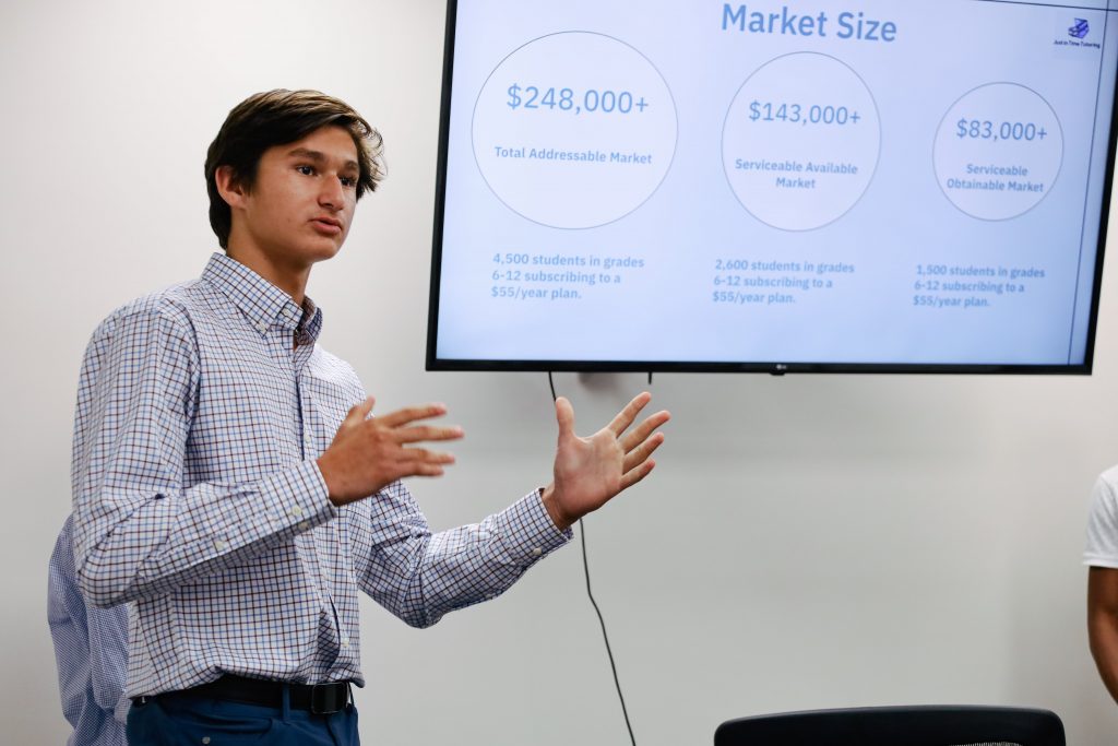 GHCDS Student Nick Crikelair presents business pitch along with teammates during Mini Gusto week at Cane Bay Partners VI